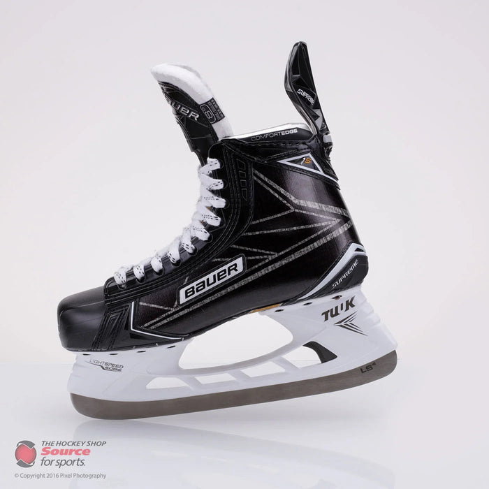 Bauer Supreme hockey skate with white laces, black boot, and Tuuk blade on white background