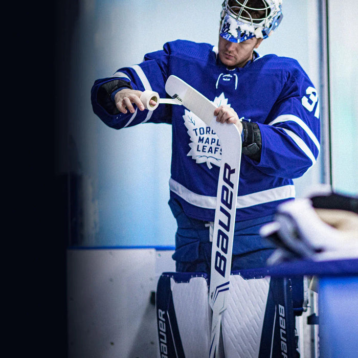 Toronto Maple Leafs goalie in Bauer gear taping stick, hockey equipment by TheHockeyShop.com