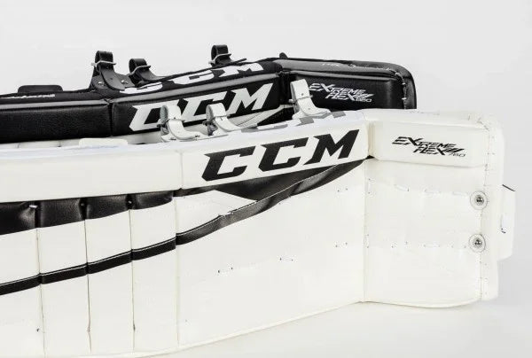 CCM Extreme Flex Pro goalie leg pads in black and white, hockey equipment at The Hockey Shop