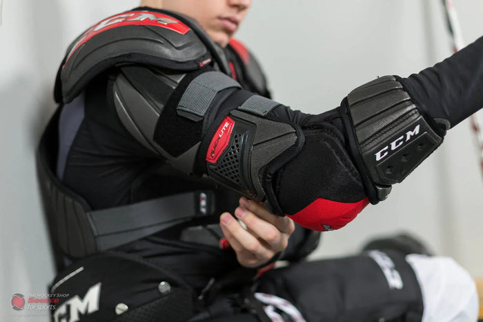 Hockey player wearing CCM Quicklite shoulder and elbow pads from The Hockey Shop