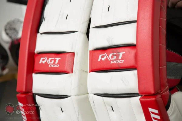 Warrior RGT Pro goalie pads in red and white at The Hockey Shop, hockey equipment store