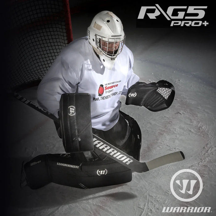 Hockey goalie in Warrior G5 Pro+ gear on ice, The Hockey Shop jersey, net in background