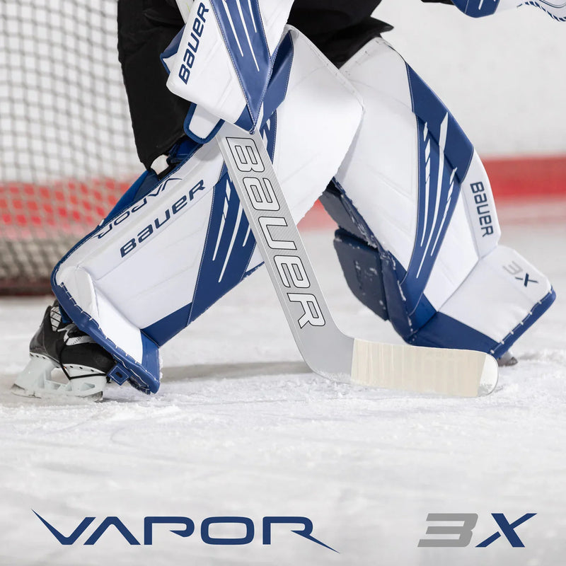 Bauer Vapor 3X goalie leg pads and stick on ice rink at TheHockeyShop.com