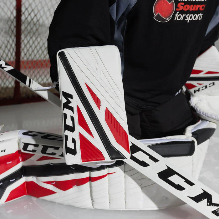 CCM E4.9 senior goalie blocker and leg pads on ice, hockey goalie gear at TheHockeyShop.com