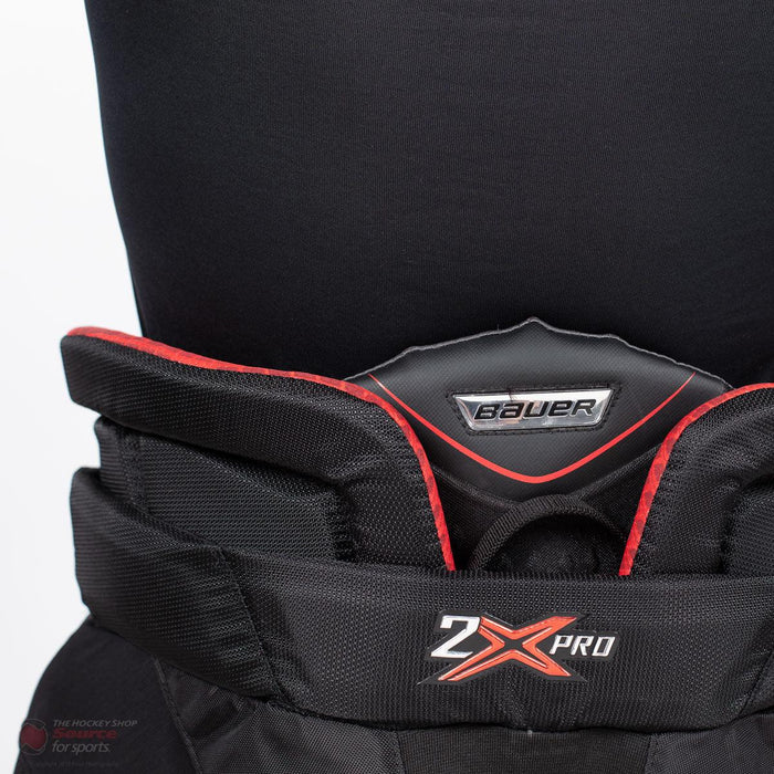 Bauer Vapor 2X Pro goalie pants black with red trim, close-up detail from TheHockeyShop.com