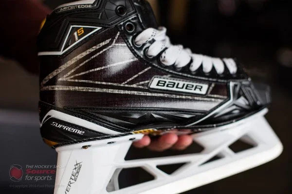 Close-up of Bauer Supreme 1S hockey skate at The Hockey Shop, displaying detailed blade and laces.
