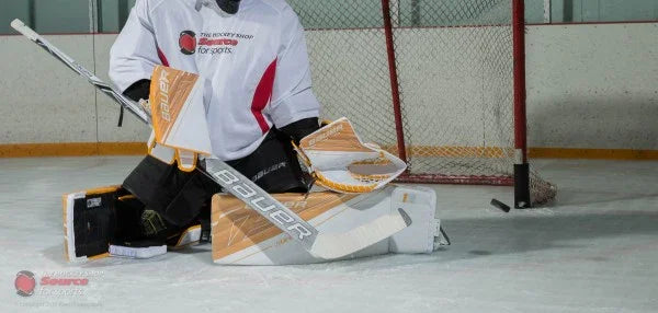 Bauer goalie pads and gear in use on ice at hockey rink, The Hockey Shop equipment demo