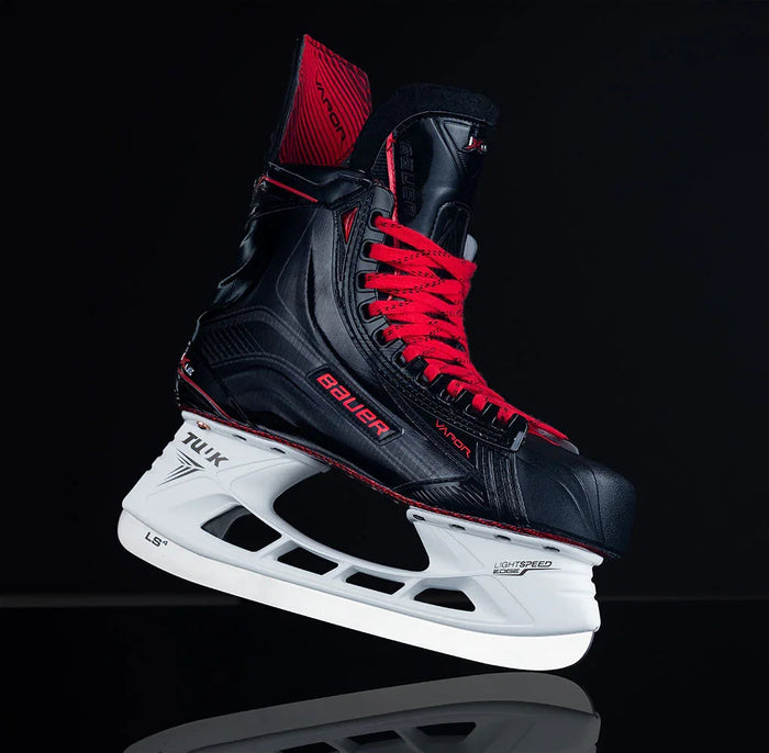 Bauer Vapor 1X LE hockey skate with red laces on black background at The Hockey Shop