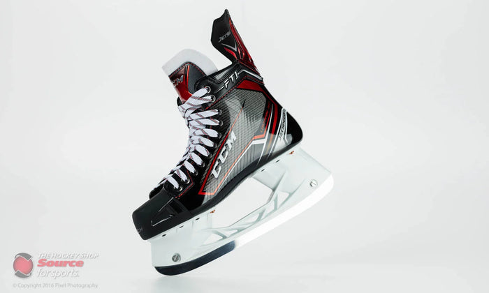 CCM JetSpeed FT1 hockey skate with black, red, and silver design on white background