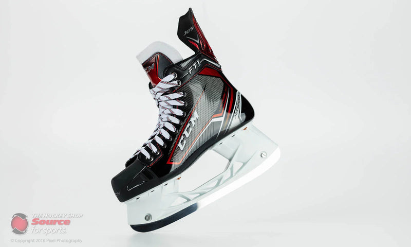 CCM JetSpeed FT1 hockey skate with black, red, and silver design on white background