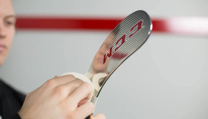 Close-up of hockey player taping CCM hockey stick blade, The Hockey Shop equipment