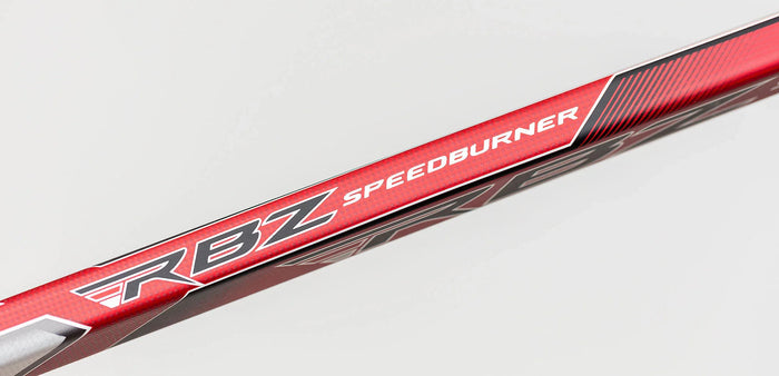 Close-up of CCM RBZ Speedburner hockey stick shaft, red and black, at TheHockeyShop.com