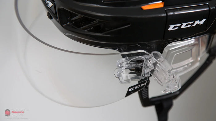 Close-up of CCM hockey helmet with clear visor, available at The Hockey Shop.
