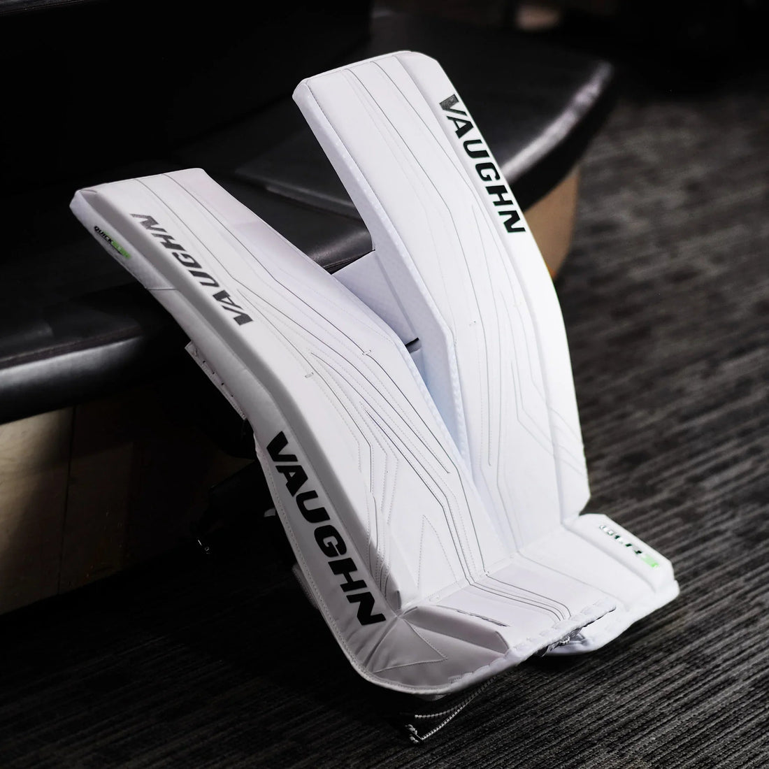 Vaughn white goalie leg pads on carpet, featured hockey equipment at TheHockeyShop.com