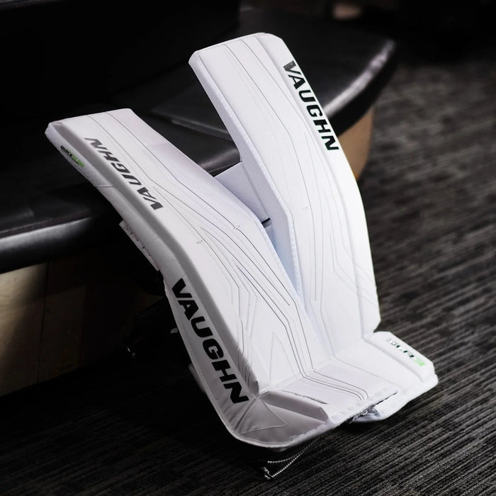 Vaughn white goalie leg pads on carpet, featured hockey equipment at TheHockeyShop.com