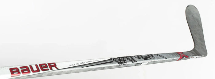 Bauer Vapor hockey stick close-up with silver, red, and black graphics, The Hockey Shop