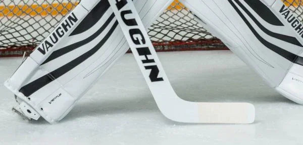 Vaughn Ventus goalie pads and stick in front of hockey net on ice at The Hockey Shop