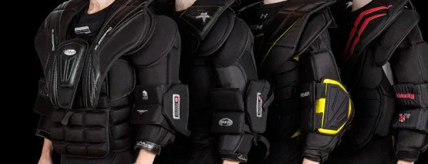 Four goalie chest protectors from top hockey brands at TheHockeyShop.com, close-up view.