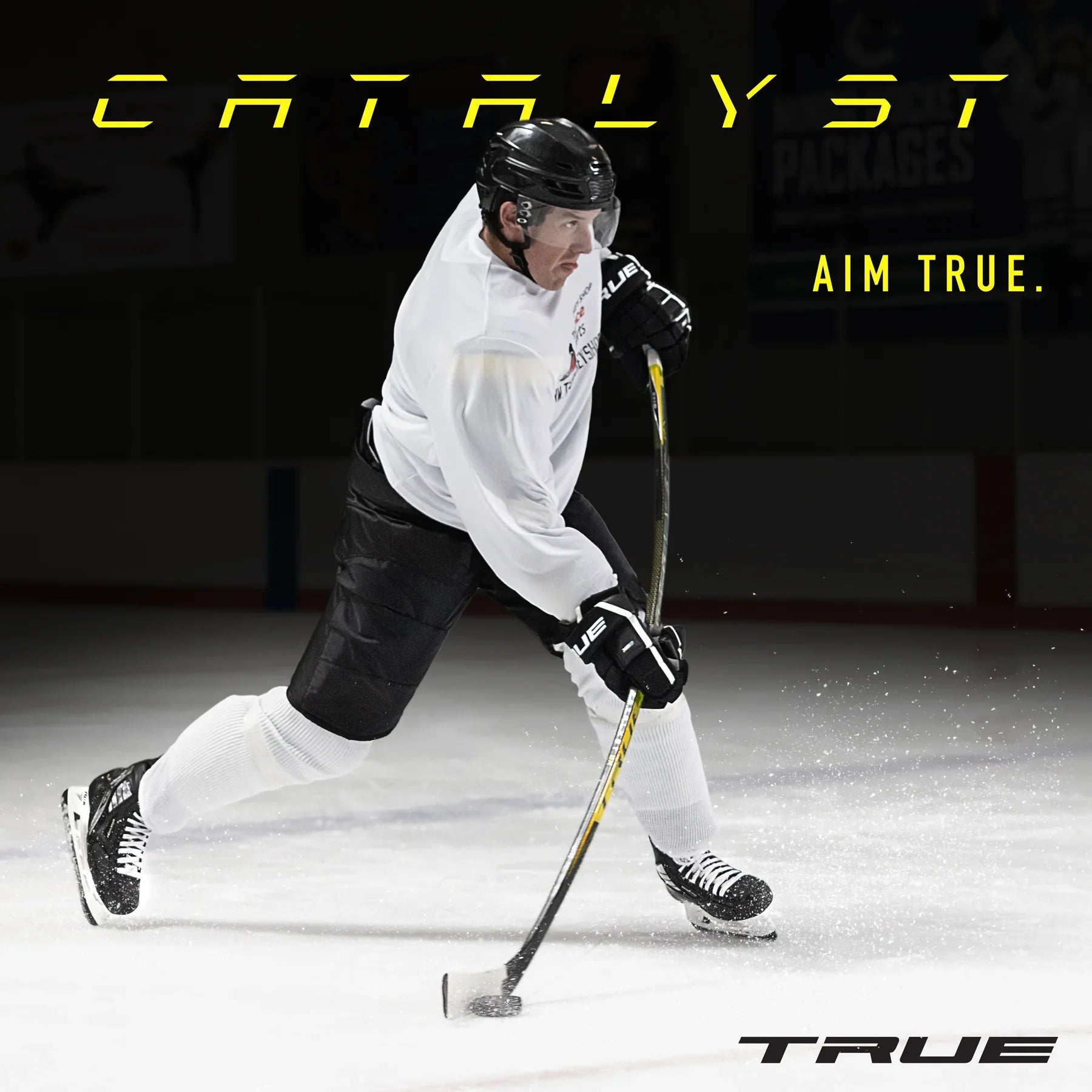 Hockey player using True Catalyst 9X stick on ice rink, wearing full gear, with visible True branding.