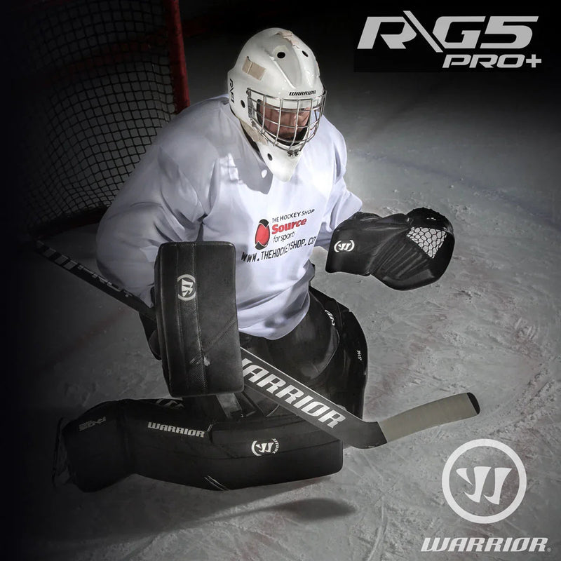 Hockey goalie in Warrior G5 Pro+ gear on ice, The Hockey Shop jersey, net in background