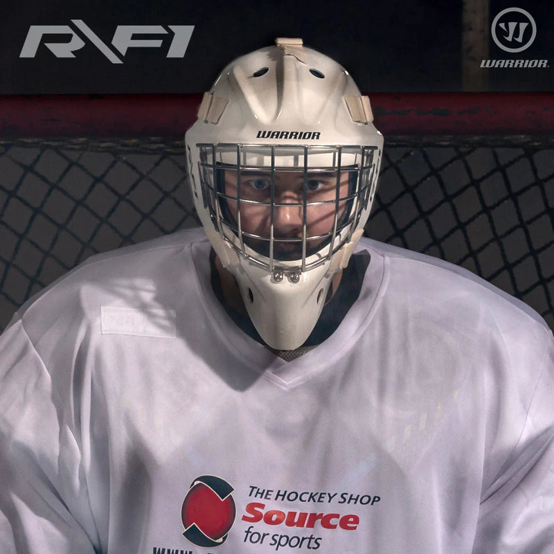 Warrior hockey goalie in RF1 Pro mask and white jersey from The Hockey Shop on ice rink