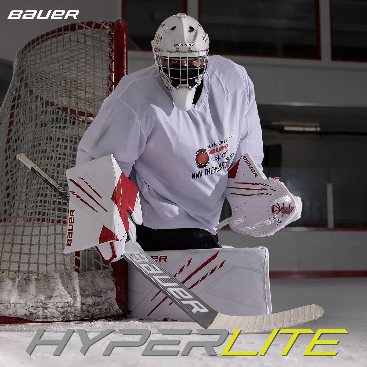 Bauer Hyperlite hockey goalie with stick and pads in front of goal at The Hockey Shop rink