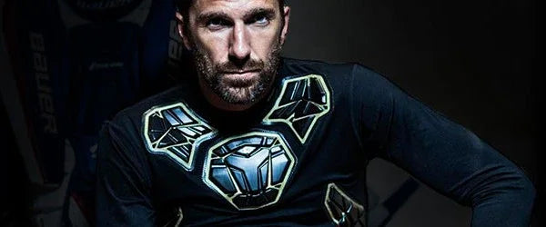 Hockey player wearing Bauer compression shirt with protective padding, sold at TheHockeyShop.com