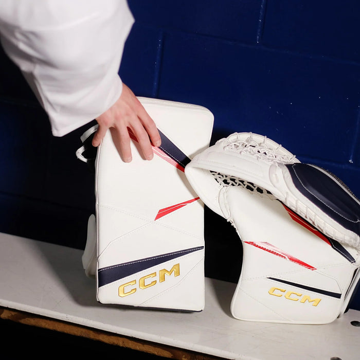 CCM goalie blocker and catcher gloves on bench, hockey equipment at The Hockey Shop