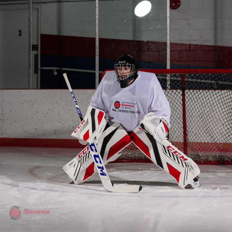 Hockey goalie in CCM Axis gear on ice in front of net at TheHockeyShop.com rink