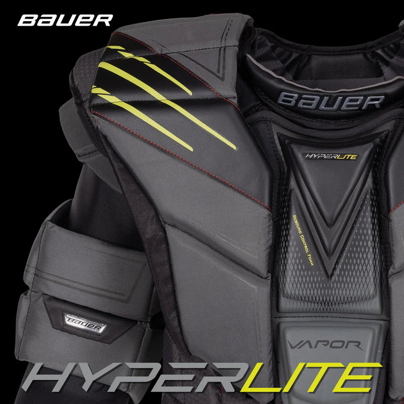 Bauer Hyperlite goalie chest protector in black with yellow accents, featured by The Hockey Shop