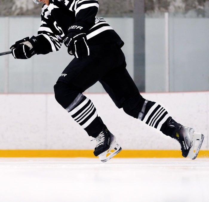 a hockey player skating on the ice