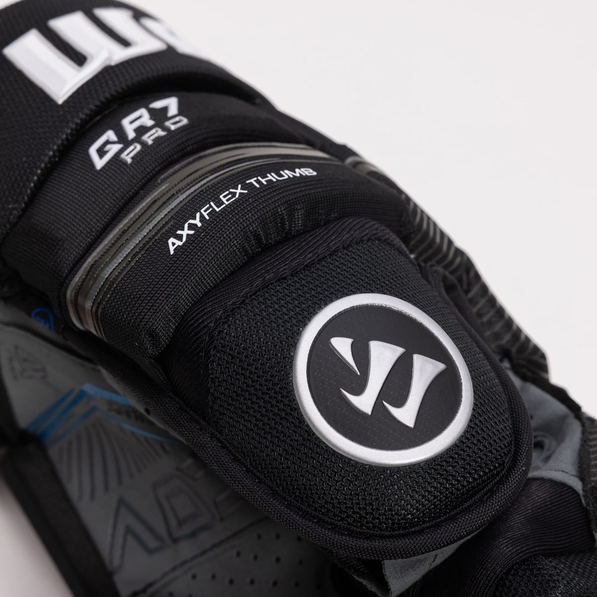 Close-up of the thumb and text graphics of of the QR7 Pro glove