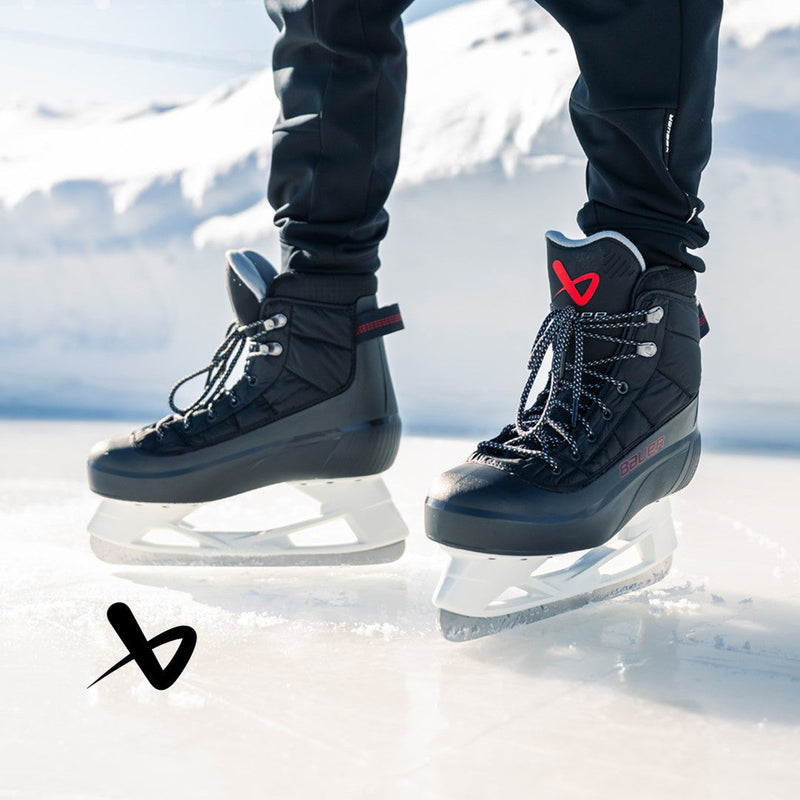 close up of someone wearing Redline Heated skates on ice