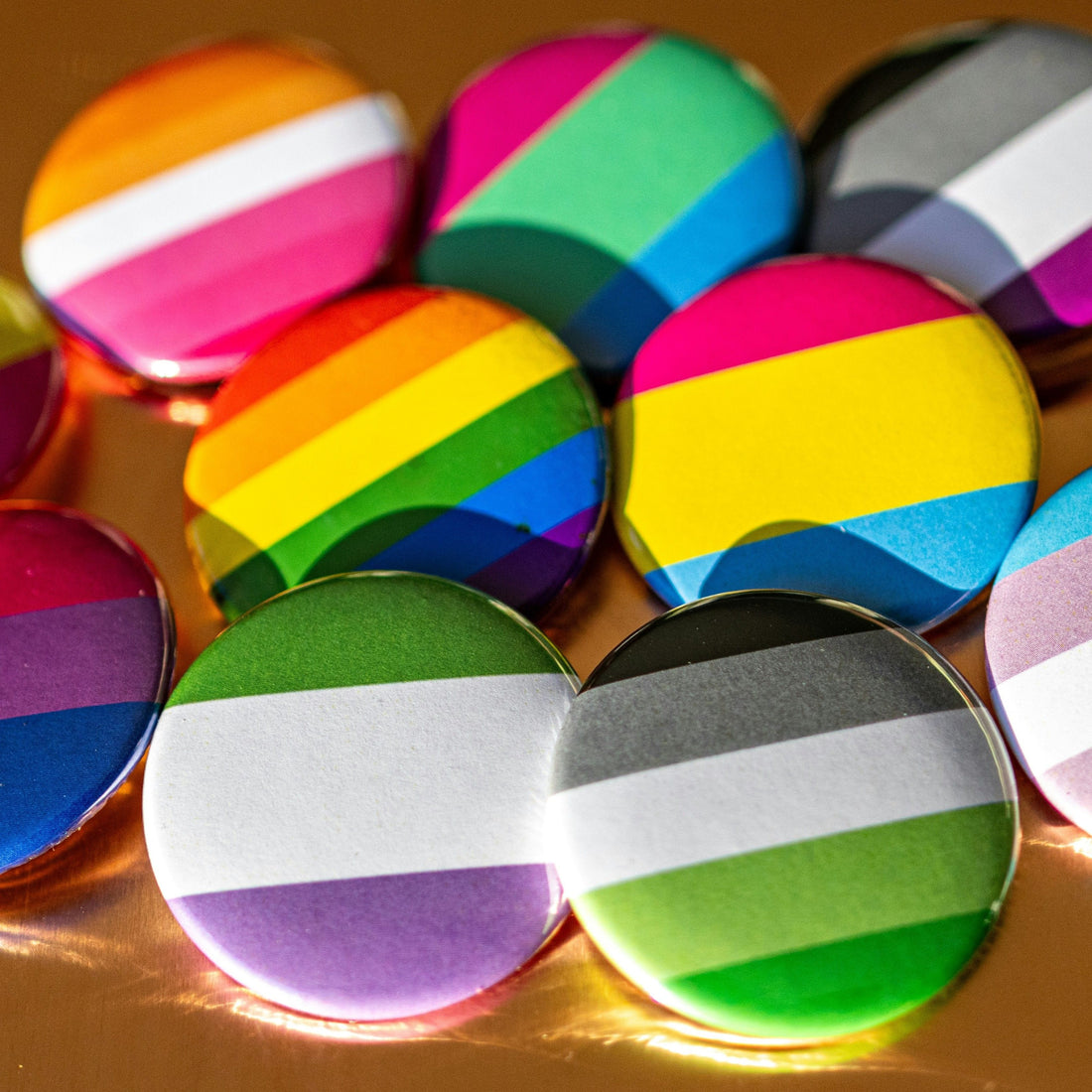 buttons with LGBTQ+ flags on them