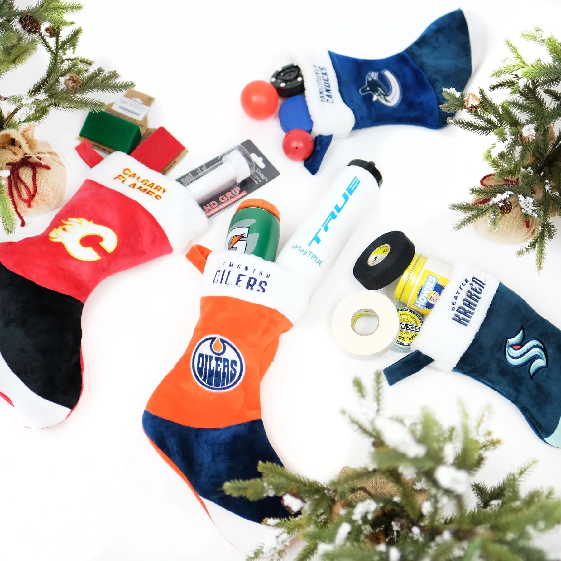 Hockey-themed Christmas stockings with NHL team logos filled with hockey gear and accessories