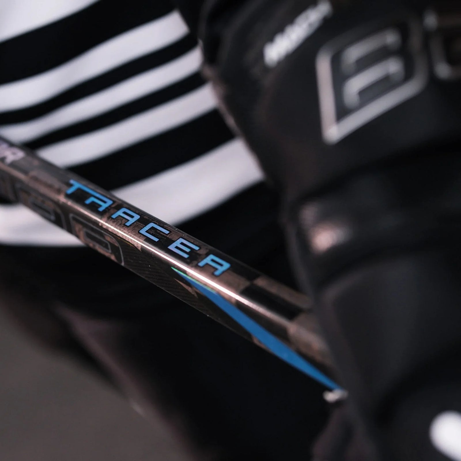 close up of a hockey player holding the Nexus Tracer