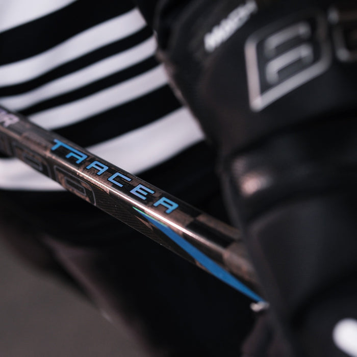 close up of a hockey player holding the Nexus Tracer