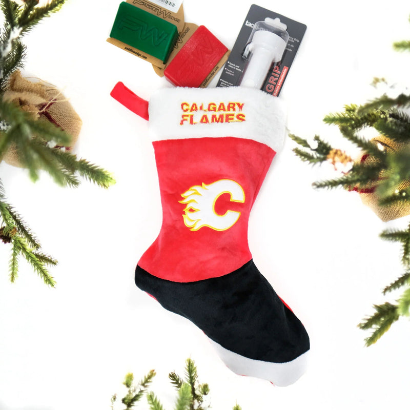 Calgary Flames Christmas stocking with hockey accessories surrounded by pine branches