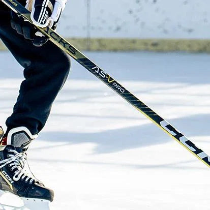 Player using CCM hockey skates and Jetspeed AS-V Pro stick on outdoor ice rink