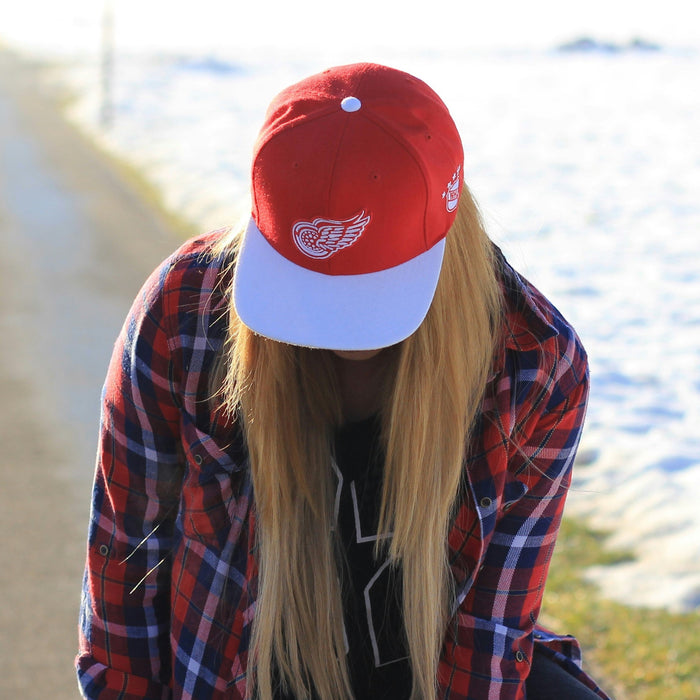 Girl in a Detroit Red Wings cap