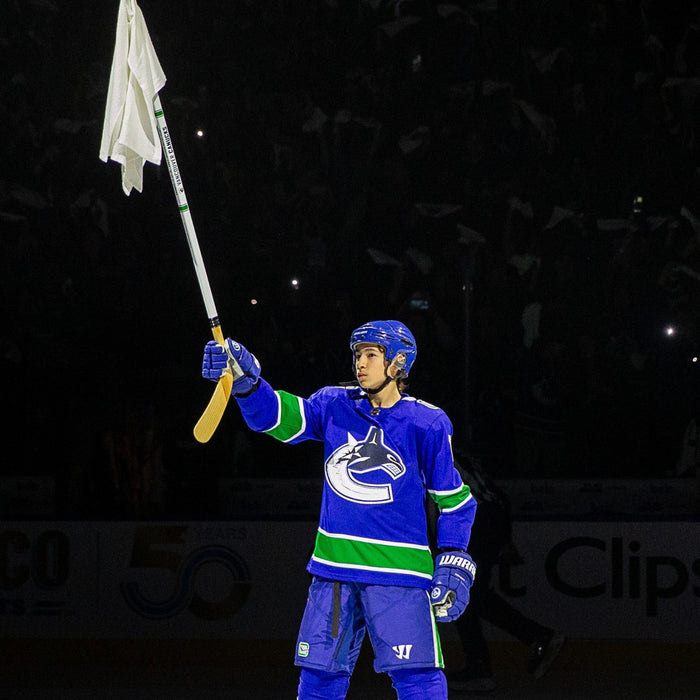 Preview Image: Timur Gabbassov from the New Westminster U15 A1 team waving a white towel at the 2024 NHL playoffs in Rogers Arena, Vancouver