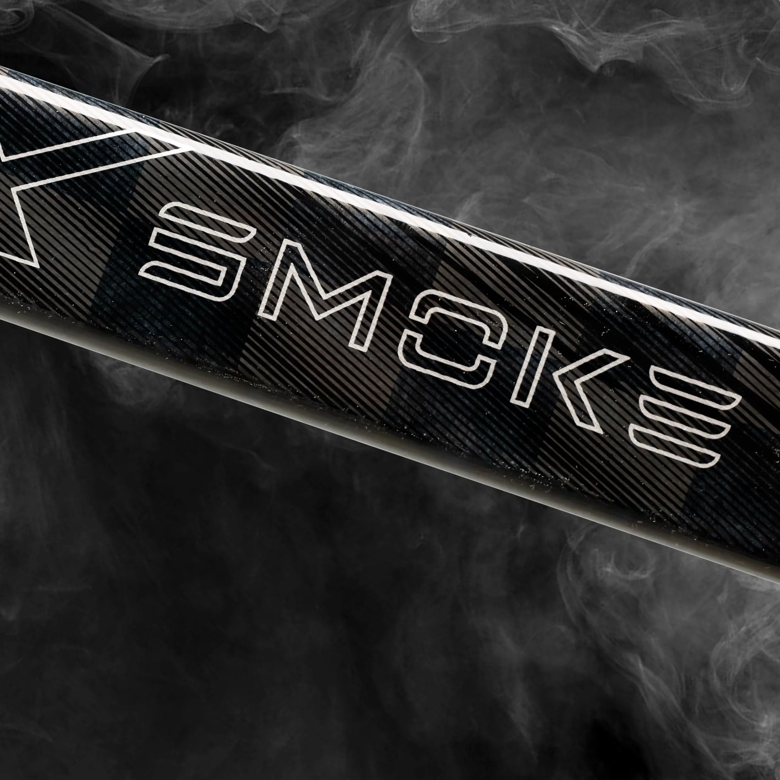 Close-up of the Project X Smoke logo on the stick