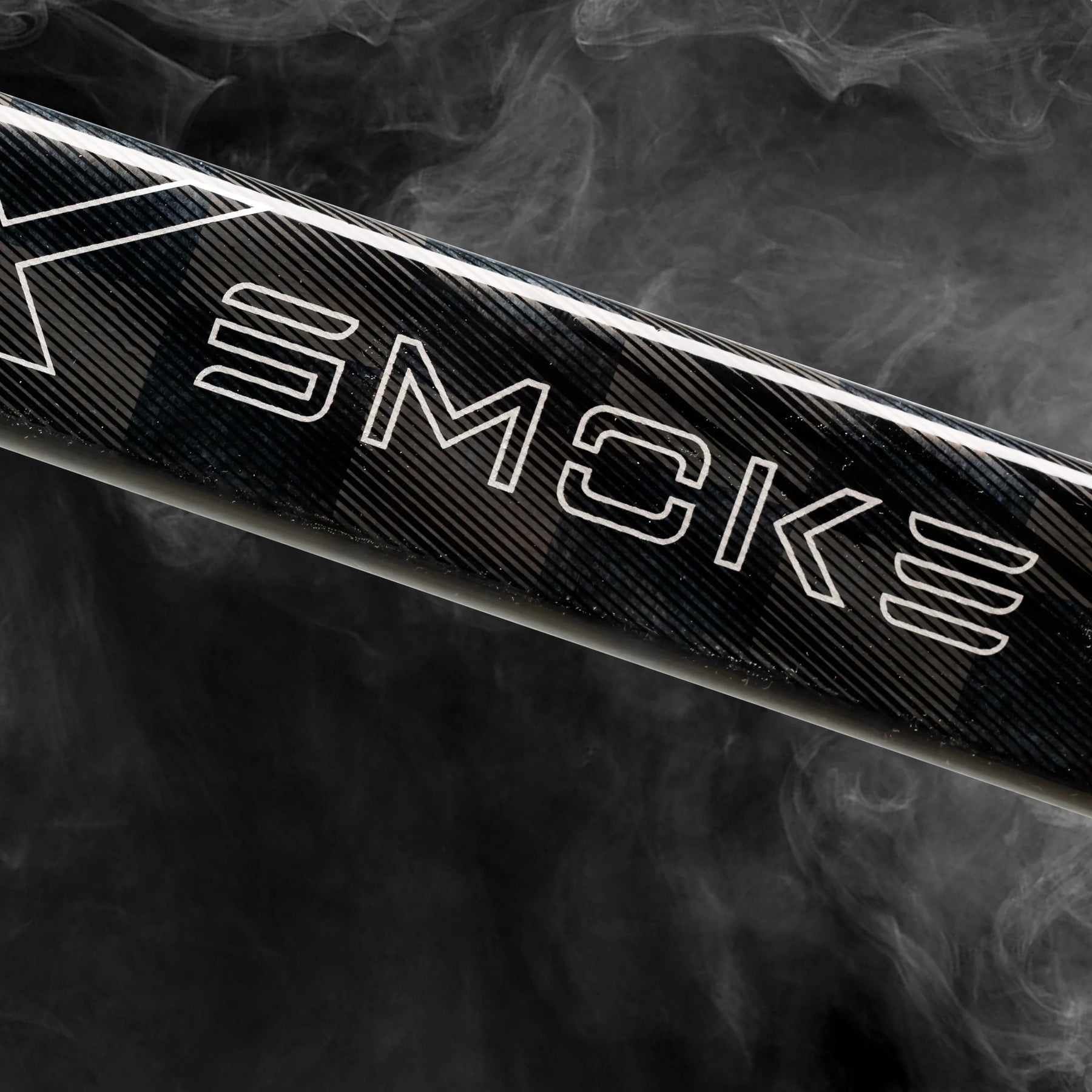 Close-up of the Project X Smoke logo on the stick