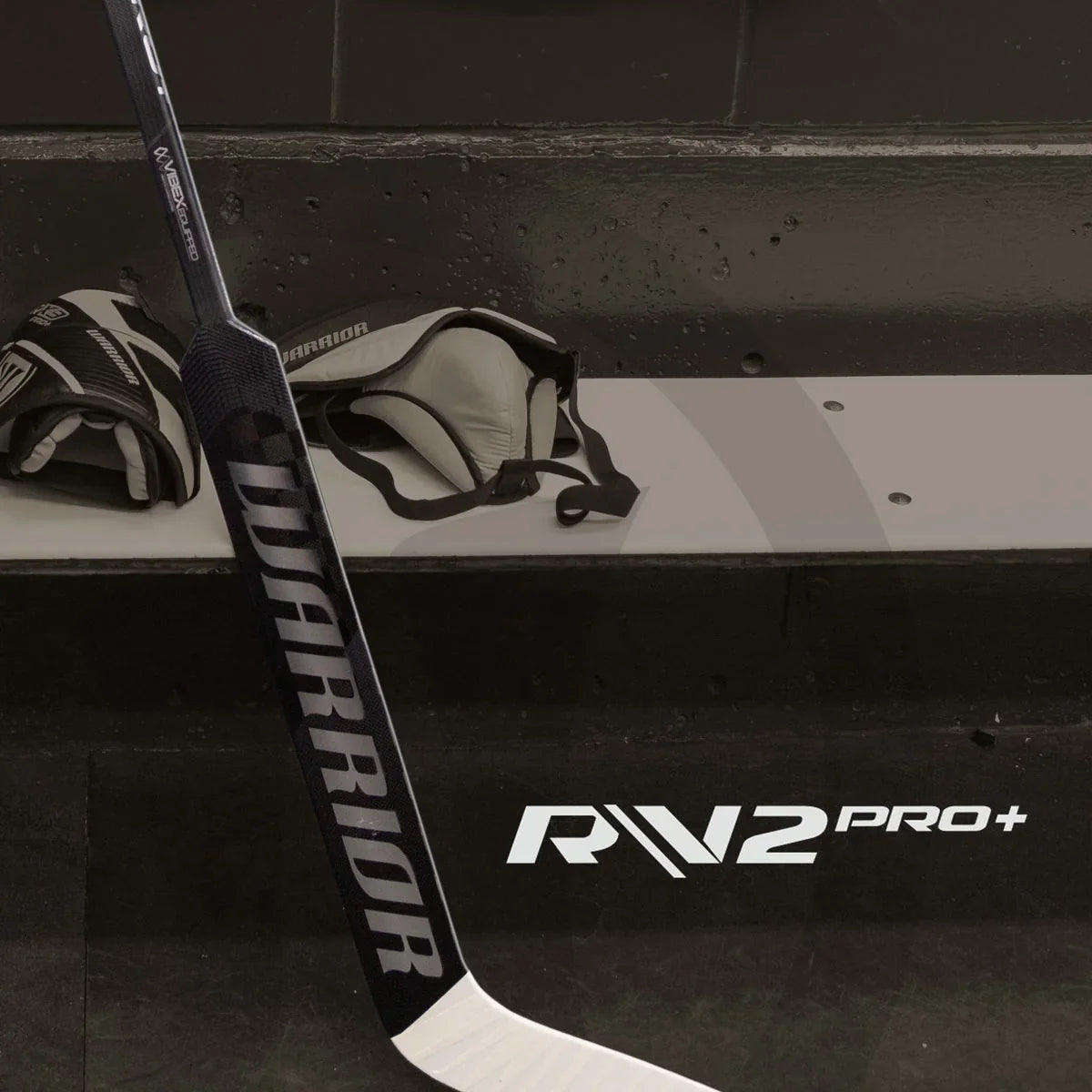 Warrior RX3 Pro+ goalie stick and hockey gloves on locker room bench at TheHockeyShop.com